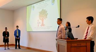 An image of students giving a presentation 