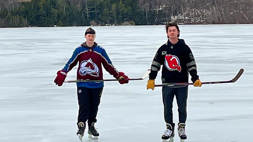 image of Alex and Brooke Weinman on the pond, a familiar sight